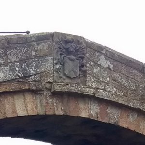 The carving on the north face of the parapet is of the Neville coat of arms.