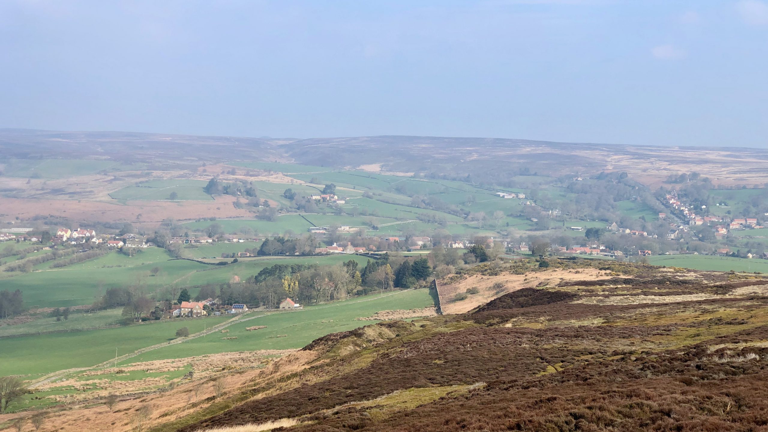 A view looking north along Ainthorpe Rigg. in the distance is the village of Danby.